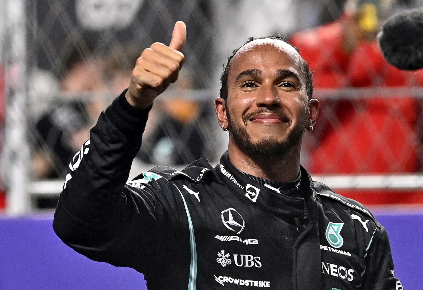 epa09621927 British Formula One driver Lewis Hamilton of Mercedes-AMG Petronas celebrates at parc ferme after taking the pole position in the qualifying for the 2021 Formula One Grand Prix of Saudi Arabia at the Jeddah Corniche Circuit in Jeddah, Saudi Arabia, 04 December 2021. The inaugural Formula One Grand Prix of Saudi Arabia will take place on 05 December 2021.  EPA/STR