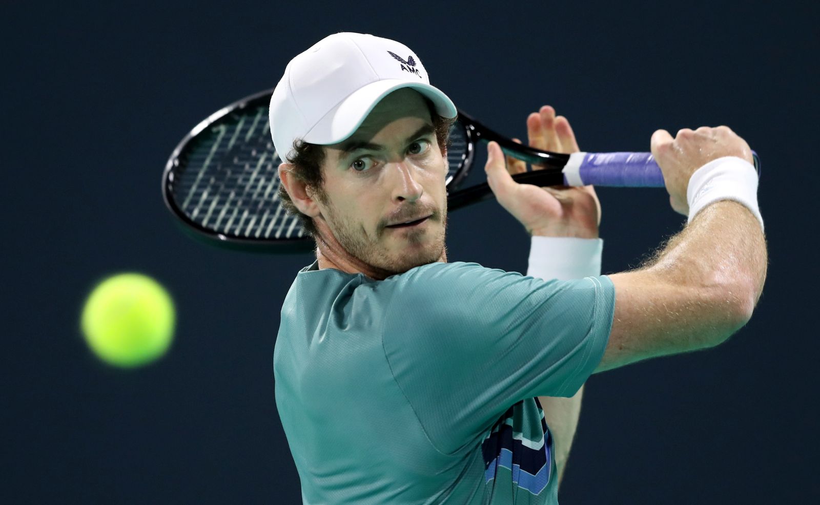 epa09647065 Andy Murray of Great Britain eyes the ball during his semi final match against Rafael Nadal of Spain during the Mubadala World Tennis Championship at the International Tennis Centre, Zayed Sports City in Abu Dhabi, United Arab Emirates, 17 December 2021.  EPA/ALI HAIDER