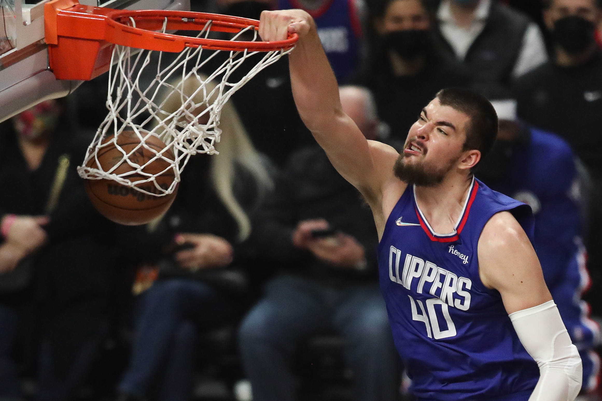 epa09652135 LA Clippers center Ivica Zubac scores against the San Antonio Spurs during the first quarter of the NBA basketball game between the Los Angeles Clippers and San Antonio Spurs at the Staples Center in Los Angeles, California, USA, 20 December 2021.  EPA/CAROLINE BREHMAN  SHUTTERSTOCK OUT