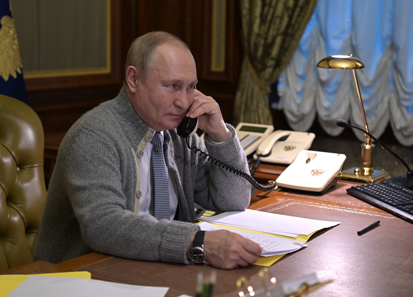 epa09658095 Russian President Vladimir Putin speaks on the phone with participants of 'Fir Tree of Wishes' campaign in Strelna, outside St. Petersburg, Russia, 27 December 2021. The goal of the campaign is to make the New Year's dreams of orphans, children from low-income families, and disabled kids come true.  EPA/ALEXEI NIKOLSKY/SPUTNIK/KREMLIN POOL / POOL