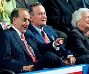 FILE PHOTO: Former Senator and former presidential candidate Bob Dole (L) sits with former President George Bush and former first lady Barbara Bush (R) on the second night of the 2004 Republican National Convention at Madison Square Garden in New York, August 31, 2004. REUTERS/Gary Hershorn/File Photo