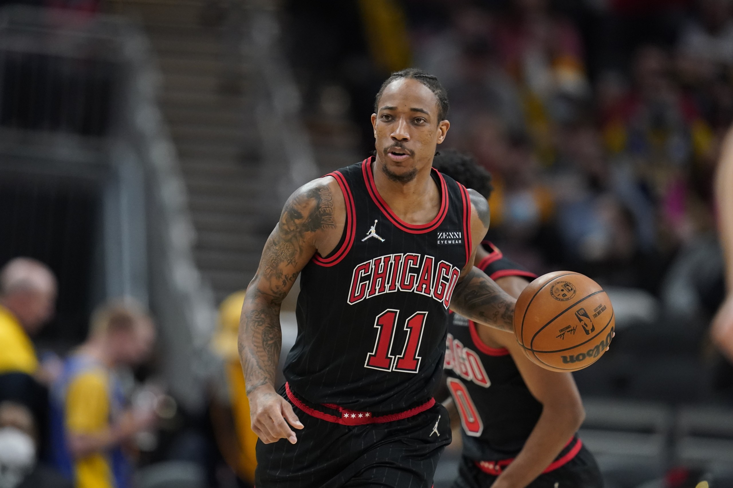 Chicago Bulls' DeMar DeRozan (11) dribbles during the second half of an NBA basketball game against the Indiana Pacers, Friday, Dec. 31, 2021, in Indianapolis. (AP Photo/Darron Cummings)