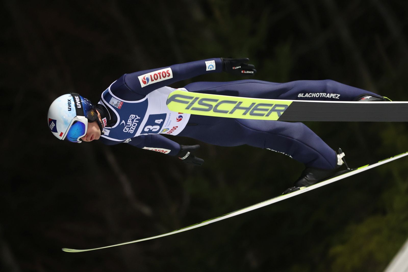 epa09621417 Kamil Stoch of Poland in action during the team competition of the FIS Ski Jumping World Cup at the Adam Malysz Ski Jump in Wisla, Poland, 04 December 2021.  EPA/Grzegorz Momot POLAND OUT