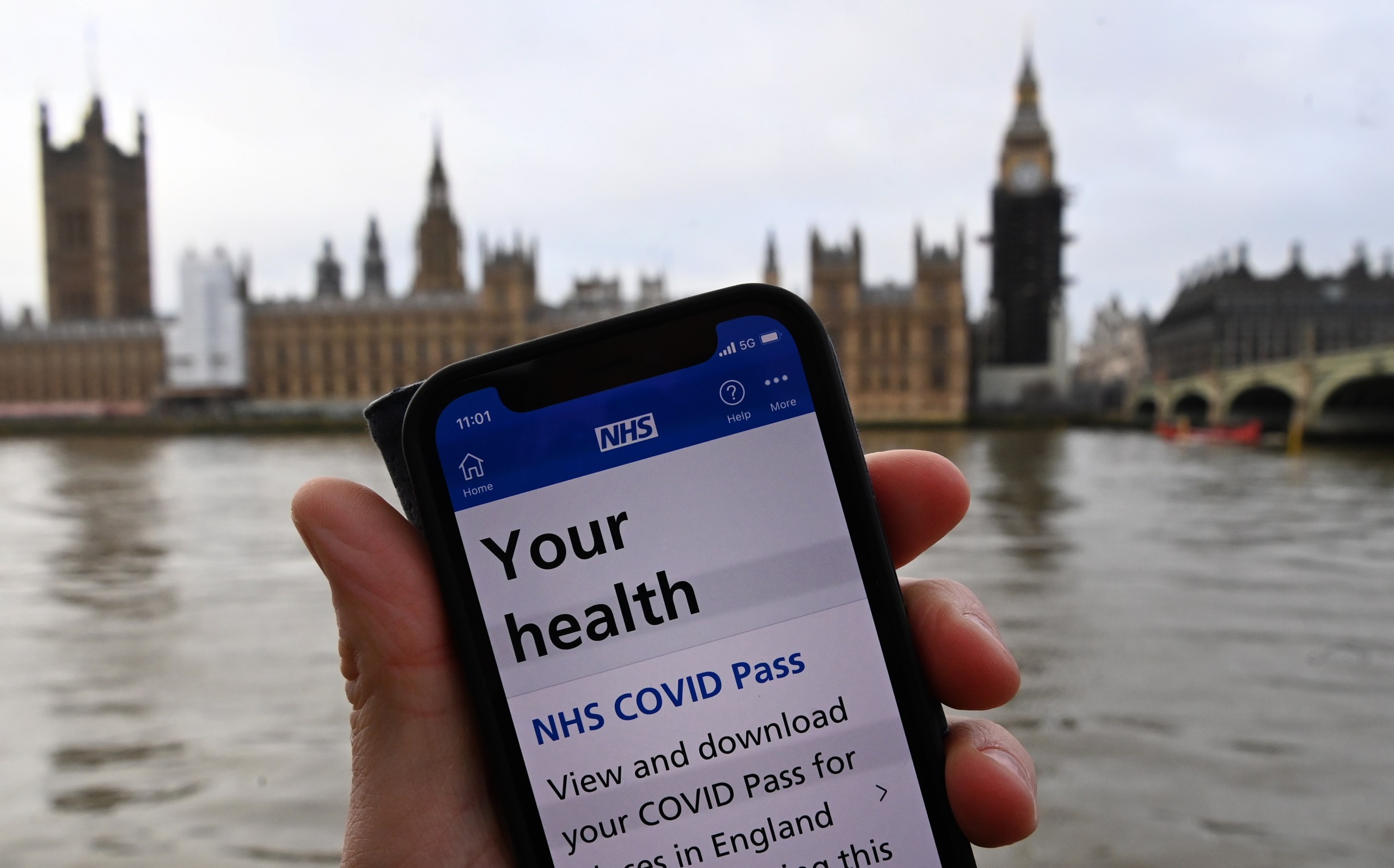 epa09641257 A Covid-19 pass is displayed on a mobile handset in London, Britain, 14 December 2021. Parliament in England is set to vote on the controversial Covid passports as Prime Minister Boris Johnson looks to push through his the new measures to counter the spread of the Omicron variant. Over seventy of Johnson's MP's are against the so called Covid passports, which could be mandatory for people to enter large events. The UK government has warned the public that the country is facing a 'tidal wave' of Omicron infections.  EPA/ANDY RAIN