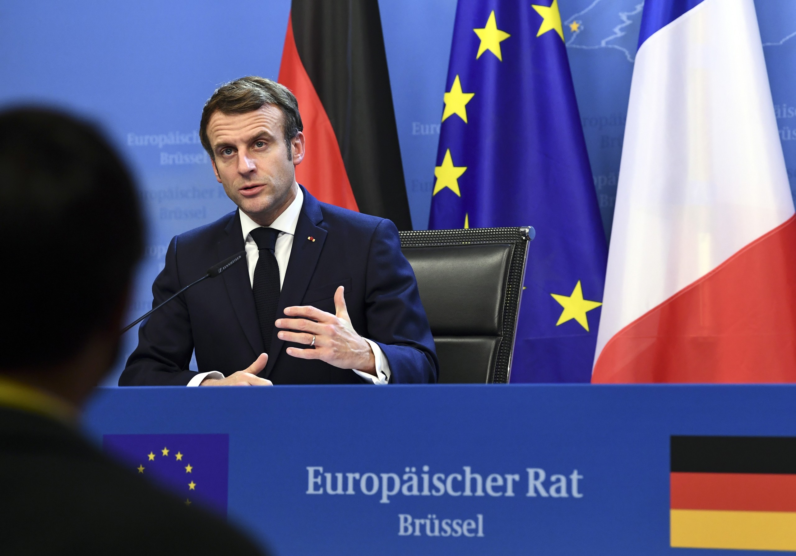 epa09645879 France's President Emmanuel Macron speaks during a joint press conference with Germany's Chancellor Olaf Scholz (out of frame) during an European Union (EU) summit at the European Council Building at the EU headquarters in Brussels, Belgium, 17 December 2021.  EPA/JOHN THYS / POOL