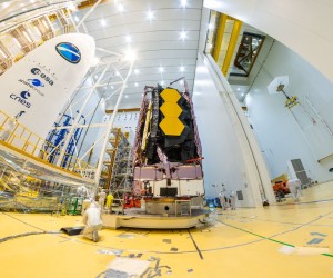 epa09648334 A handout picture made available by the European Space Agency (ESA) shows NASA's James Webb Space Telescope being secured on top of the Ariane 5 rocket that will launch it to space from Europe's Spaceport in Kourou, French Guiana, 11 December 2021 (issued 18 December 2021). The National Aeronautics and Space Administration (NASA) announced that The James Webb Space Telescope (JWST) is confirmed for the target launch date of 24 December 2021, at 7:20 a.m. EST (13:20 CET). Webb is an international partnership between NASA, ESA, and the Canadian Space Agency (CSA). Webb's primary mirror will collect light for the observatory in the scientific quest to better understand our solar system and beyond.  EPA/ESA/MANUEL PEDOUSSAUT HANDOUT  HANDOUT EDITORIAL USE ONLY/NO SALES