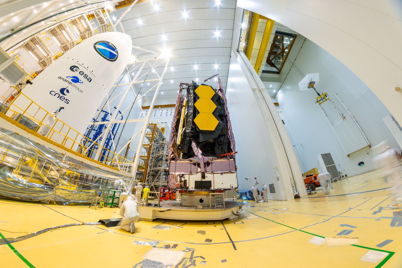 epa09648334 A handout picture made available by the European Space Agency (ESA) shows NASA's James Webb Space Telescope being secured on top of the Ariane 5 rocket that will launch it to space from Europe's Spaceport in Kourou, French Guiana, 11 December 2021 (issued 18 December 2021). The National Aeronautics and Space Administration (NASA) announced that The James Webb Space Telescope (JWST) is confirmed for the target launch date of 24 December 2021, at 7:20 a.m. EST (13:20 CET). Webb is an international partnership between NASA, ESA, and the Canadian Space Agency (CSA). Webb's primary mirror will collect light for the observatory in the scientific quest to better understand our solar system and beyond.  EPA/ESA/MANUEL PEDOUSSAUT HANDOUT  HANDOUT EDITORIAL USE ONLY/NO SALES