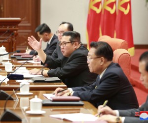 epa09659217 A photo released by the official North Korean Central News Agency (KCNA) shows North Korean leader Kim Jong Un (C) attending the 4th Plenary Meeting of the 8th Central Committee of the Workers' Party of Korea in Pyongyang, North Korea, 27 December 2021 (Issued 29 December 2021).  EPA/KCNA  Editorial use only. Please use this caption  EDITORIAL USE ONLY