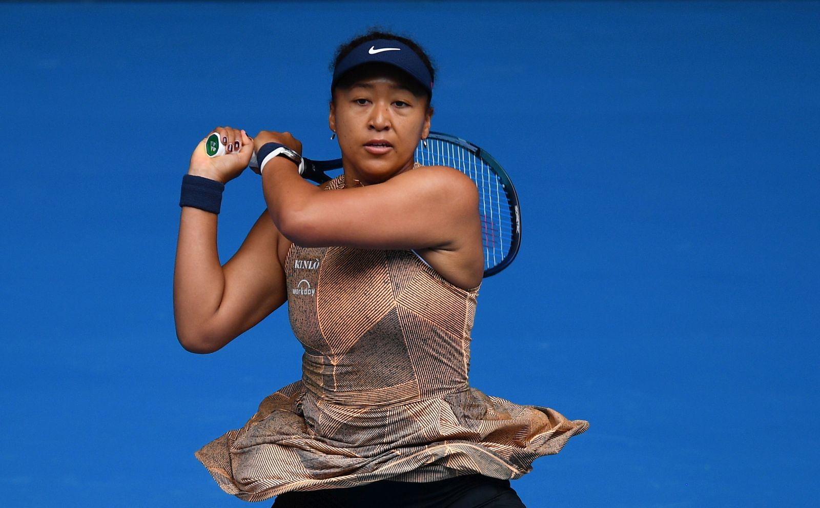epa09665401 Naomi Osaka of Japan in action during her match against Alize Cornet of France on day two of the Melbourne Summer Set tennis tournament at Melbourne Park in Melbourne, Australia, 04 January 2022.  EPA/JAMES ROSS  AUSTRALIA AND NEW ZEALAND OUT
