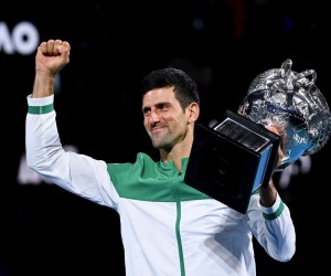 epa09668648 (FILE) Novak Djokovic of Serbia lifts the Norman Brooks Challenge Cup after winning his Men's singles finals match against Daniil Medvedev of Russia on Day 14 of the Australian Open Grand Slam tennis tournament at Melbourne Park in Melbourne, Australia, 21 February 2021 (re-isssued 05 January 2022).  Novak Djokovic was denied entry to Australia after his visa was refused amid a vaccine exemption row.  EPA/DAVE HUNT AUSTRALIA AND NEW ZEALAND OUT *** Local Caption *** 56713640
