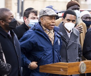 epa09677620 New York City Mayor Eric Adams (C) speaks during a press conference outside of the apartment building at East 181st Street which was the scene of yesterday’s 5-alarm apartment fire in the Bronx borough of New York, New York, USA, 10 January 2022. Seventeen people were killed in the fire on 09 January and thirteen people are in critical condition following the fire which was reportedly started by a faulty space heater according to the Mayor of New York City.  EPA/JUSTIN LANE