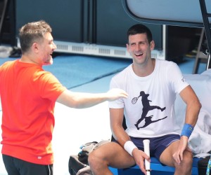 epa09678333 A handout photo made available by Tennis Australia of Novak Djokovic (R) of Serbia and his physiotherapist Ulises Badio during a practice session ahead of the Australian Open, Melbourne Park, in Melbourne, Australia 11 January 2022.  EPA/SCOTT BARBOUR / Tennis Australia HANDOUT  HANDOUT EDITORIAL USE ONLY/NO SALES/NO ARCHIVES