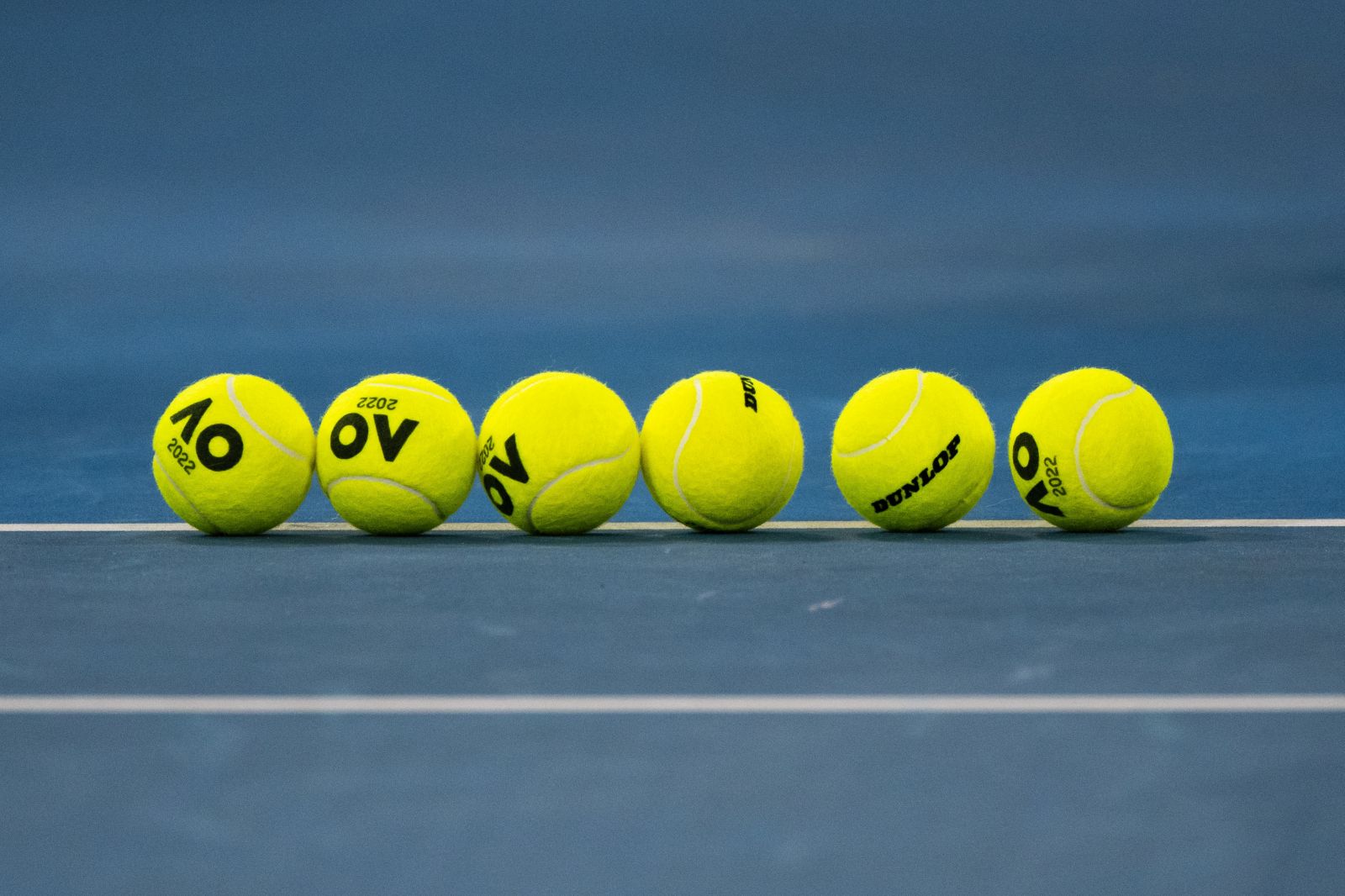 epa09678406 Australian Open 2022 balls seen on the court during Day 2 of the Sydney Tennis Classic at Ken Rosewall Arena, in Sydney, Australia, 11 January 2022.  EPA/JAMES GOURLEY AUSTRALIA AND NEW ZEALAND OUT