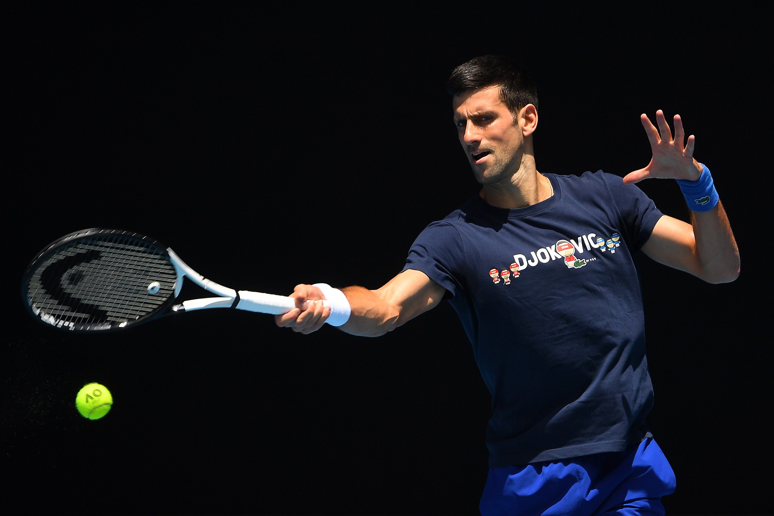 epa09679676 Novak Djokovic of Serbia is seen in action  during a training session at Melbourne Park in Melbourne, Australia, 12 January 2022.  EPA/JAMES ROSS  AUSTRALIA AND NEW ZEALAND OUT