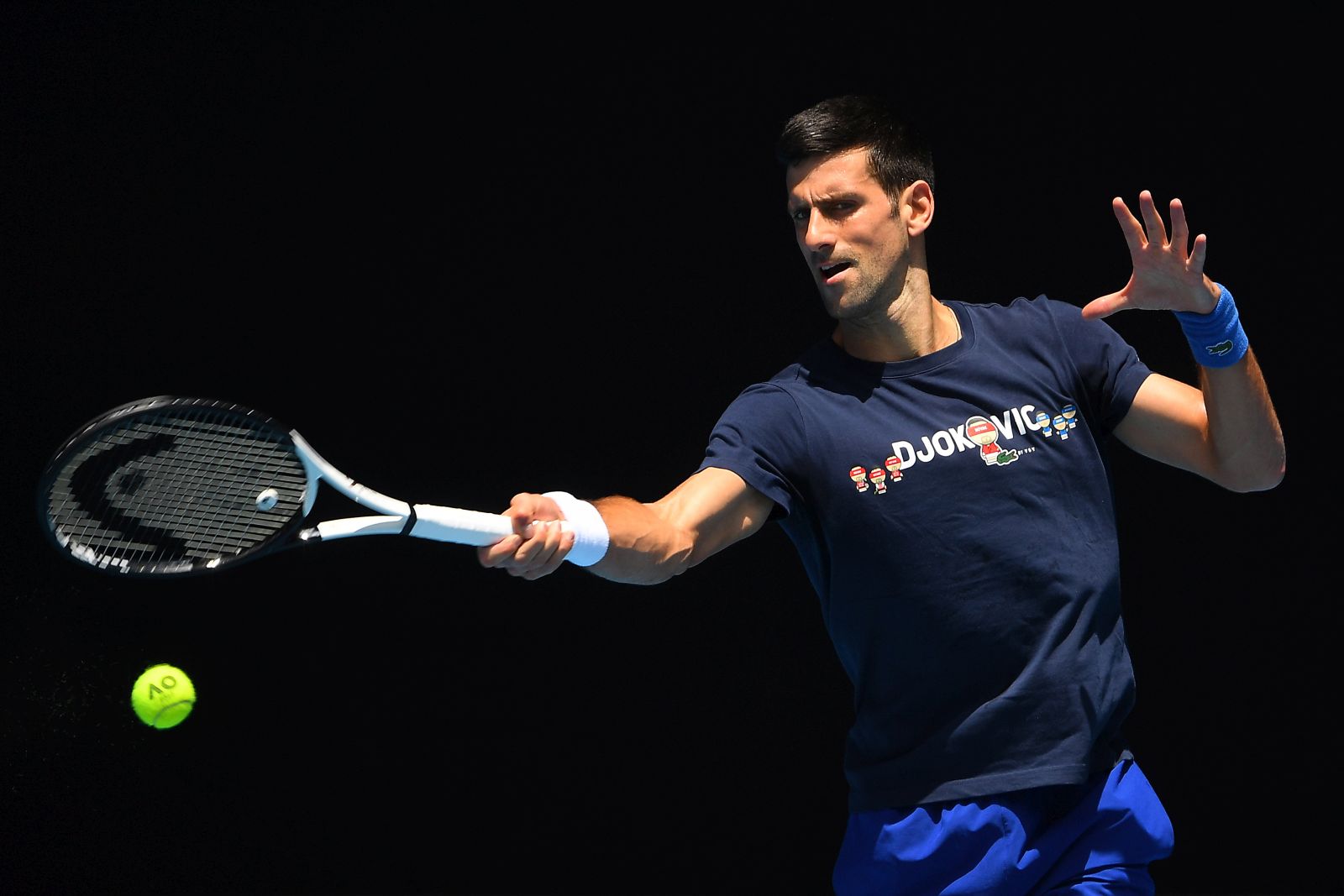 epa09679676 Novak Djokovic of Serbia is seen in action  during a training session at Melbourne Park in Melbourne, Australia, 12 January 2022.  EPA/JAMES ROSS  AUSTRALIA AND NEW ZEALAND OUT
