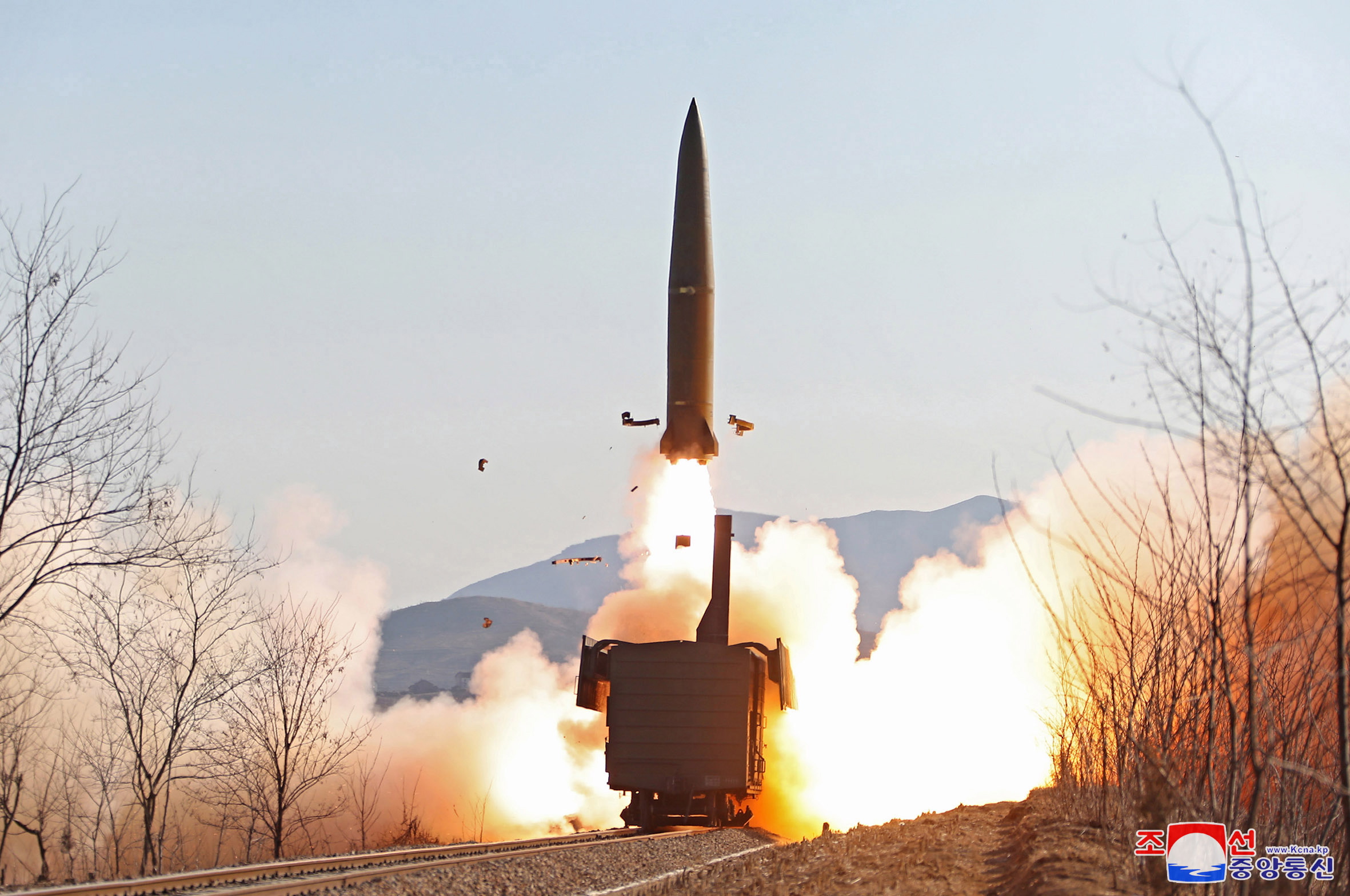 epa09686374 A photo released by the official North Korean Central News Agency (KCNA) shows a a missile fired from a railway during a firing drill of the railway-borne missile regiment held in North Pyongan Province, North Korea on 14 January 2022 (issued on 15 January 2022).  EPA/KCNA   EDITORIAL USE ONLY