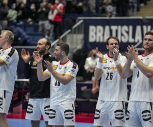 epa09689801 Players of Germany celebrate after winning the Men's European Handball Championship preliminary round match between Germany and Austria in Bratislava, Slovakia, 16 January 2022.  EPA/MARTIN DIVISEK