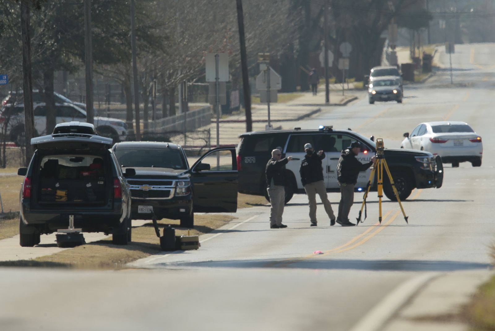 epa09689876 Law enforcement personnel continue the investigation to the hostage incident at Congregation Beth Israel Synagogue in Colleyville, Texas, USA, 16 January 2022. Four hostages were held by a gunman for ten hours in Congregation Beth Israel Synagogue on 15 January 2022 before the gunman was killed. The gunman was later identified as Malik Faisal Akram, a British citizen.  EPA/RALPH LAUER