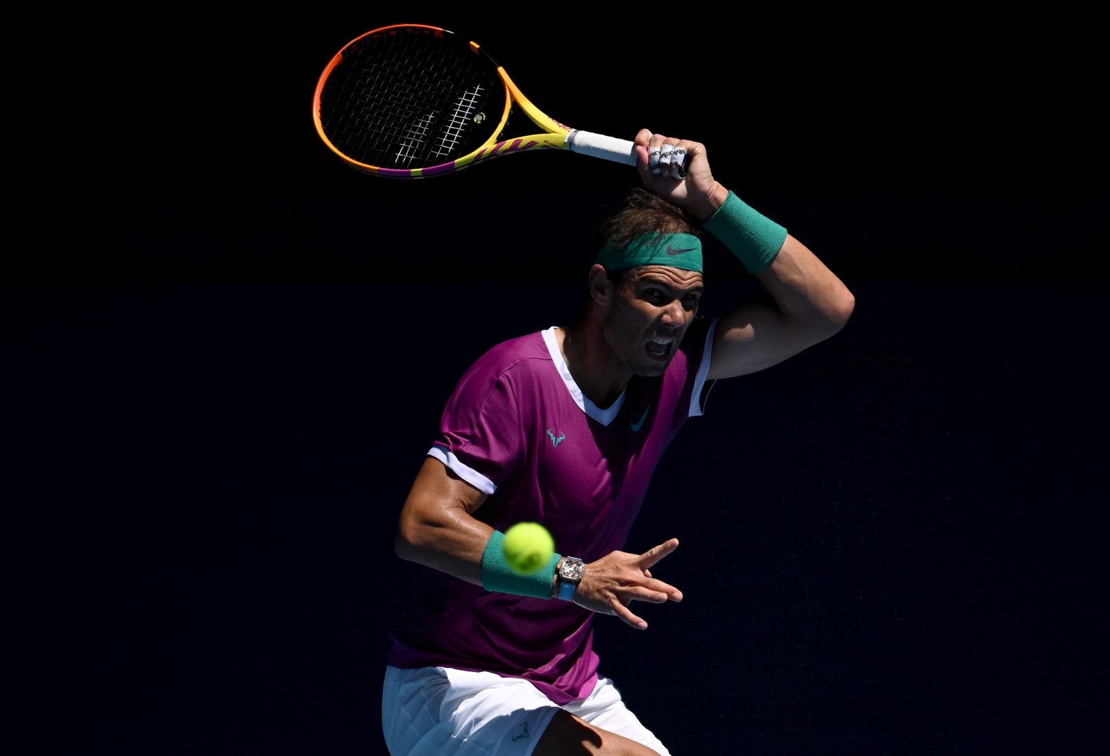 epa09694189 Rafael Nadal of Spain returns to Yannick Hanfmann of Germany in their second round match during the Australian Open tennis tournament, at Melbourne Park, in Melbourne, Australia, 19 January 2022.  EPA/DAVE HUNT AUSTRALIA AND NEW ZEALAND OUT