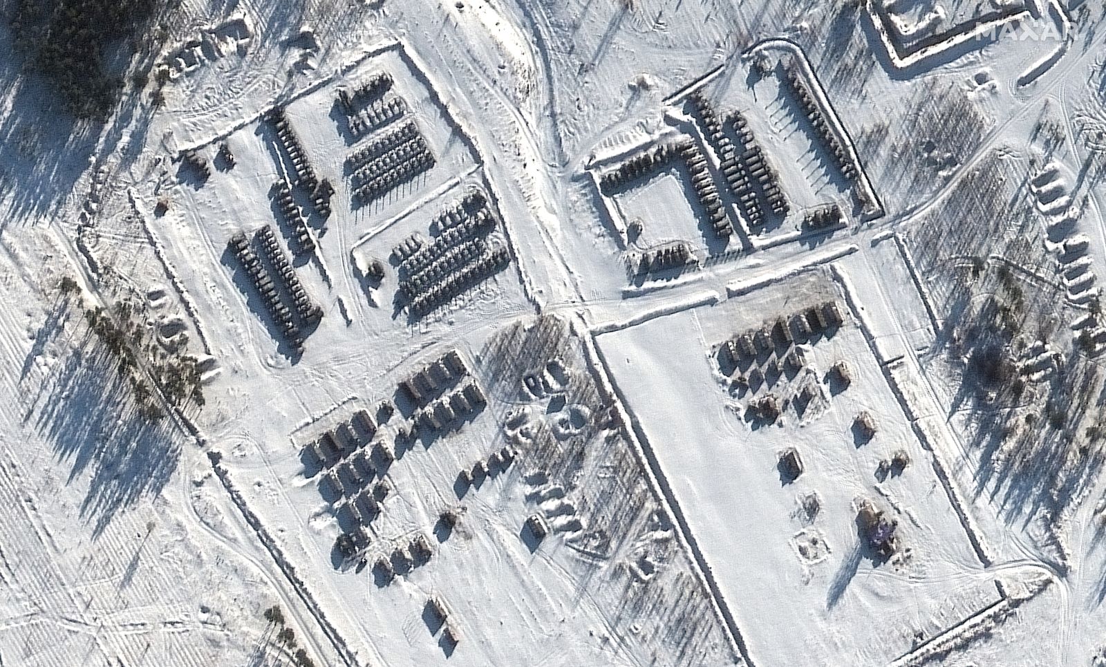 epa09696330 A handout satellite image made available by Maxar Technologies shows a battle group at Pogonovo training area in Voronezh, Russia, 19 January 2022. Tensioins between Russia and Ukraine are at their highest in many years, as Russian troop build-up near the two nations borders raise fears that Russia could launch an invasion.  EPA/MAXAR TECHNOLOGIES HANDOUT -- MANDATORY CREDIT: SATELLITE IMAGE 2021 MAXAR TECHNOLOGIES -- the watermark may not be removed/cropped -- HANDOUT EDITORIAL USE ONLY/NO SALES