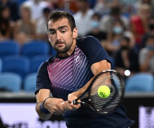 epa09701725 Marin Cilic of Croatia plays a shot during his third round match against Andrey Rublev of Russia on Day 6 of the Australian Open, at Melbourne Park, in Melbourne, Australia, 22 January 2022.  EPA/DEAN LEWINS  AUSTRALIA AND NEW ZEALAND OUT