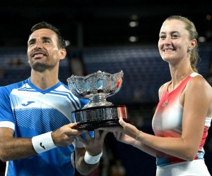 epa09713568 Ivan Dodig of Croatia (L) and Kristina Mladenovic of France pose with the winners trophy after their Mixed Doubles Final win against Jaimee Fourlis and Jason Kubler of Australia at the Australian Open Grand Slam tennis tournament at Melbourne Park, in Melbourne, Australia, 28 January 2022.  EPA/DEAN LEWINS AUSTRALIA AND NEW ZEALAND OUT