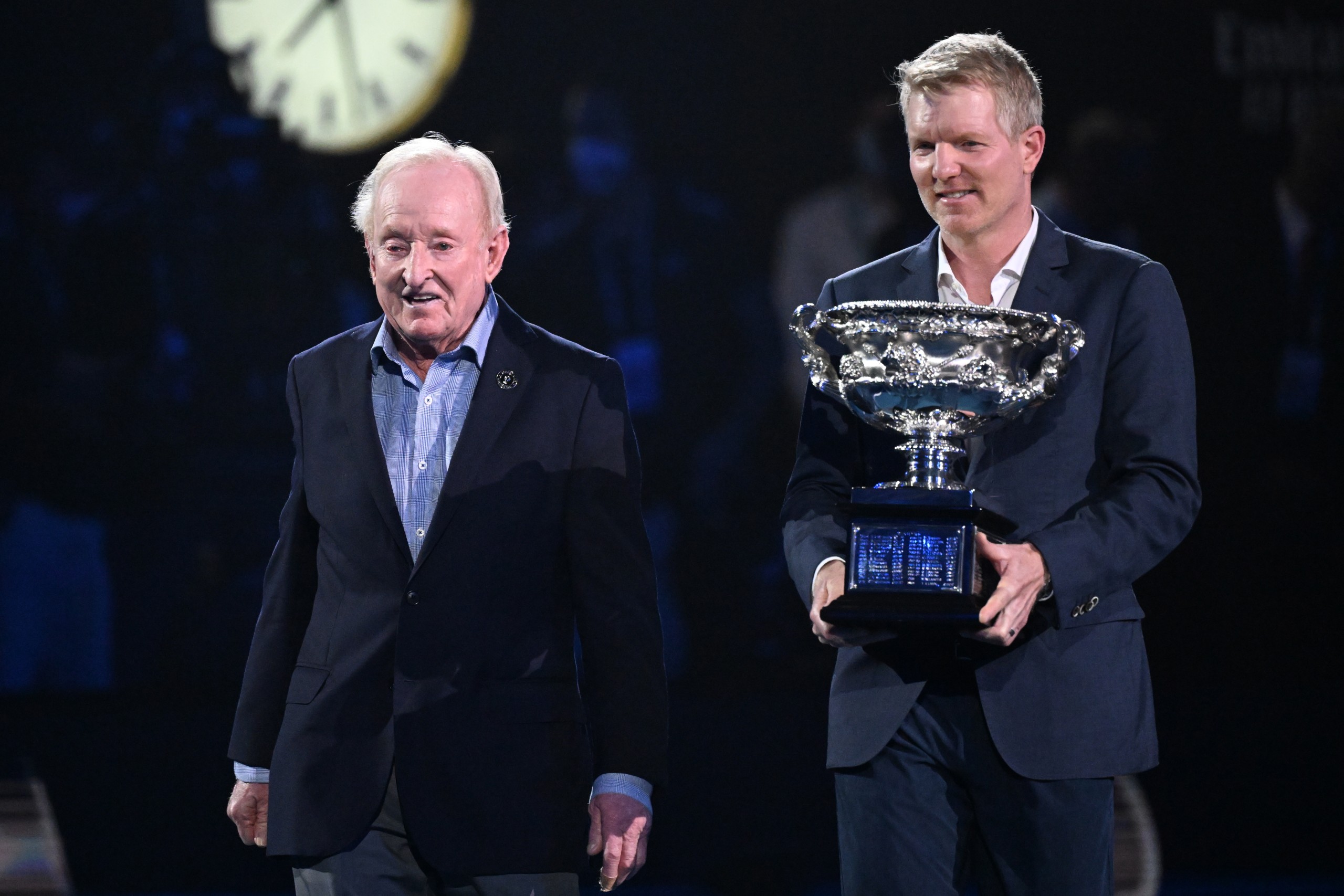 epa09717801 Former tennis greats Jim Courier (R) and Rod Laver with the Norman Brooks Challenge Cup before the men’s singles final between Rafael Nadal of Spain and Daniil Medvedev of Russia at the Australian Open grand slam tennis tournament at Melbourne Park in Melbourne, Australia, 30 January 2022.  EPA/DEAN LEWINS AUSTRALIA AND NEW ZEALAND OUT