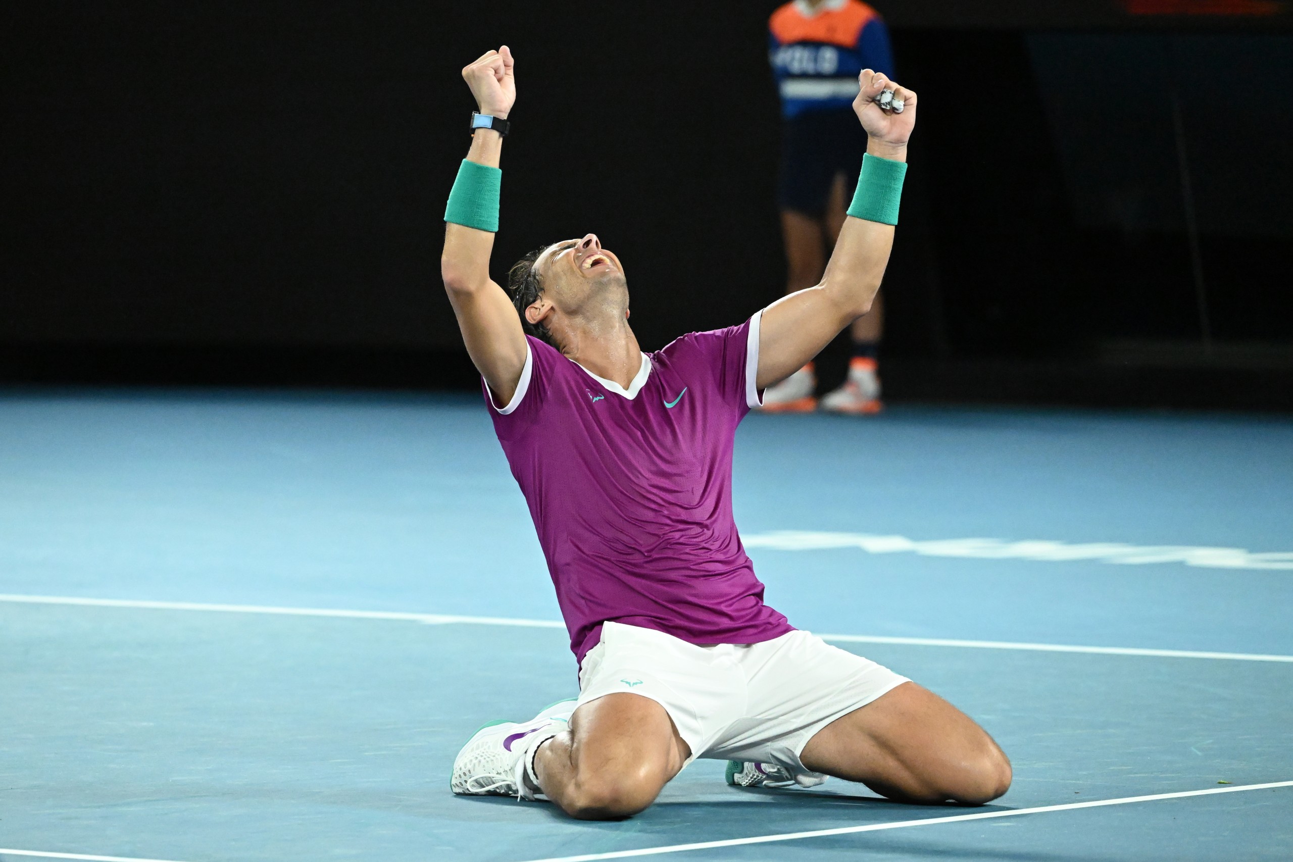 epa09718210 Rafael Nadal of Spain celebrates after defeating Daniil Medvedev of Russia in the men’s singles final at the Australian Open grand slam tennis tournament at Melbourne Park in Melbourne, Australia, 30 January 2022.  EPA/DEAN LEWINS AUSTRALIA AND NEW ZEALAND OUT