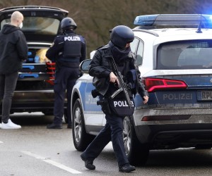 epa09719421 Police officers secure the crime scene in Ulmet, Germany, 31 January 2022. According to the police in Kaiserslautern, two police officers were shot during a routine traffic check in the district of Kusel in Rhineland-Palatinate. The background to the incident is still unclear and the perpetrator or perpetrators have not yet been arrested.  EPA/RONALD WITTEK