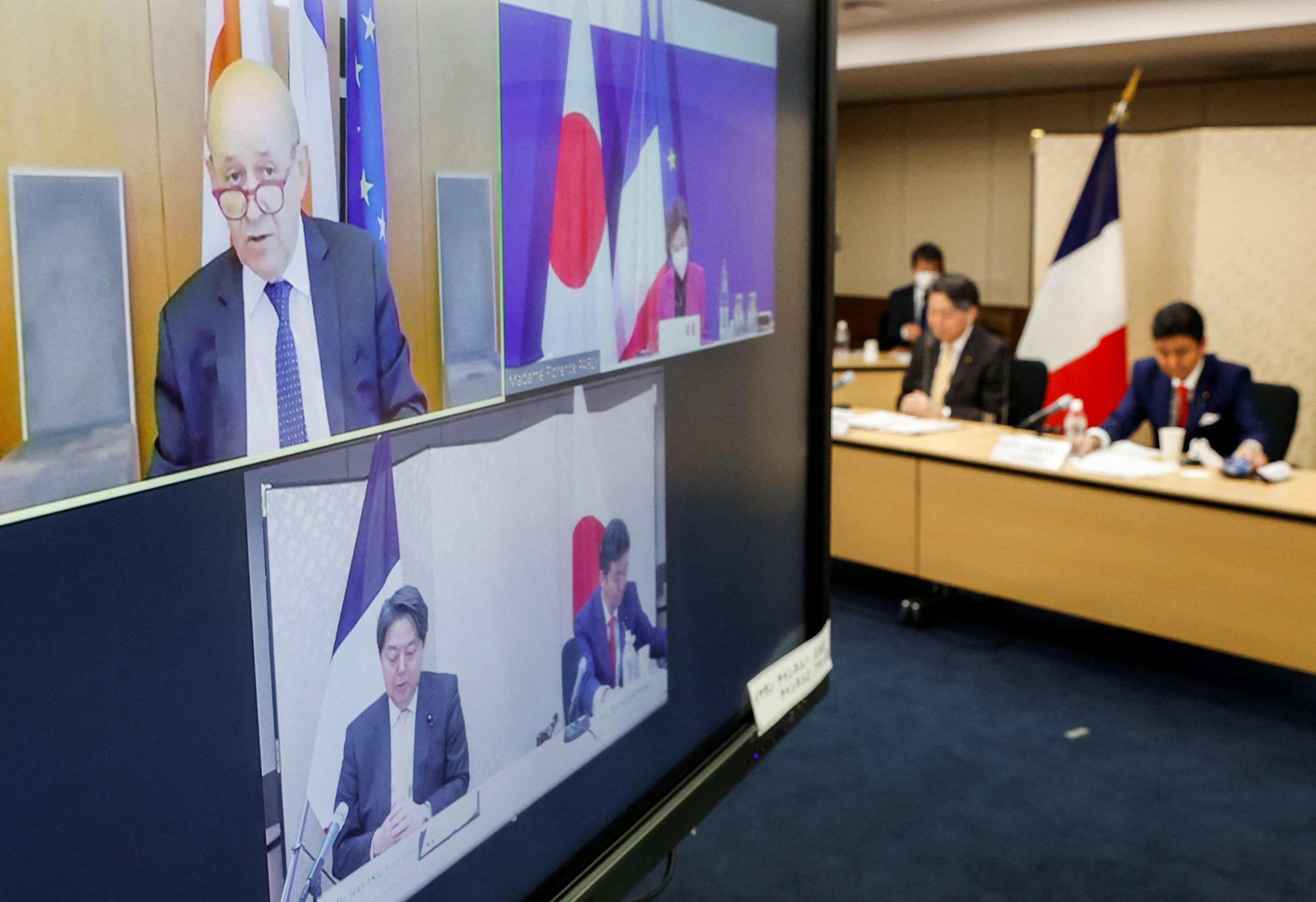 Japan's Foreign Minister Yoshimasa Hayashi and Defence Minister Nobuo Kishi and their French counterparts Jean-Yves Le Drian and Florence Parly attend a video conference at the Foreign Ministry in Tokyo, Japan January 20, 2022. REUTERS/Issei Kato/Pool Photo: ISSEI KATO/REUTERS
