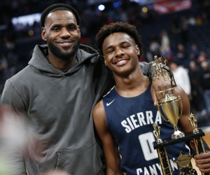 LeBron James, left, poses with his son Bronny after Sierra Canyon beat Akron St. Vincent - St. Mary in a high school basketball game, Saturday, Dec. 14, 2019, in Columbus, Ohio. (AP Photo/Jay LaPrete)