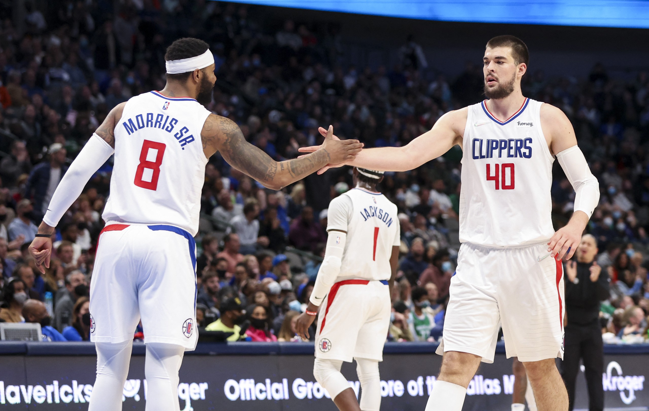 Feb 12, 2022; Dallas, Texas, USA;  LA Clippers center Ivica Zubac (40) and forward Marcus Morris Sr. (8) celebrate during the second half against the Dallas Mavericks at American Airlines Center. Mandatory Credit: Kevin Jairaj-USA TODAY Sports
