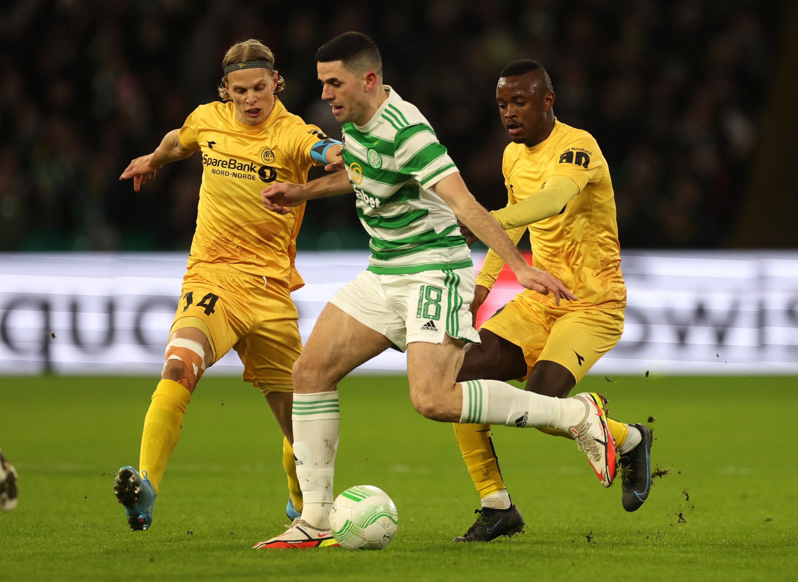 Soccer Football - Europa Conference League - Play Off First Leg - Celtic v Bodo/Glimt - Celtic Park, Glasgow, Scotland, Britain - February 17, 2022 Celtic's Tom Rogic in action with Bodo/Glimt's Ulrik Saltnes and Brice Wembangomo Action Images via Reuters/Lee Smith