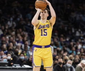Los Angeles Lakers guard Austin Reaves (15) shoots the ball against the Charlotte Hornets during the second half of an NBA basketball game in Charlotte, N.C., Friday, Jan. 28, 2022. (AP Photo/Jacob Kupferman)