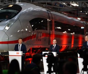 epa09720858 (L-R) Deutsche Bahn (DB) CEO Richard Lutz, German Minister for Transport and Digital Affairs Volker Wissing, and the CEO of Siemens Roland Busch attend a presentation of the new ICE 3neo train in Berlin, Germany, 01 February 2022. The Deutsche Bahn was informing about further investments in the ICE fleet.  EPA/CLEMENS BILAN