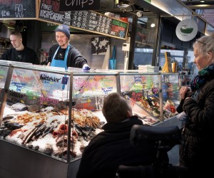 epa09721139 Customers at the fishmarket in Torvehallerne in Copenhagen, Denmark, 01 February 2022. As of today it is no longer mandatory to wear protection mask anywhere in public in Denmark. The Danish Government decided that COVID-19 is no longer categorized as a socially critical disease after 31 January 2022, and lifted its COVID restrictions.  EPA/LISELOTTE SABROE  DENMARK OUT