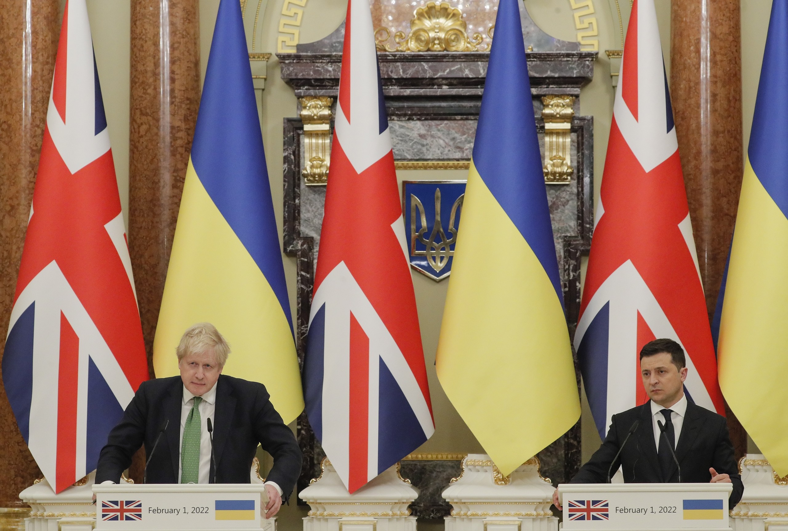 epa09721692 Ukrainian President Volodymyr Zelensky (R) and British Prime Minister Boris Johnson (L) attend a press conference following their talks at the Mariinsky palace in Kiev, Ukraine, 01 February 2022. Boris Johnson, the Prime Minister of the United Kingdom, arrived in Ukraine for a two-day visit to meet with top Ukrainian officials amid escalation on the Ukraine-Russian border.  EPA/SERGEY DOLZHENKO