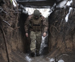 epa09723295 A Ukrainian serviceman patrols at the front line, not far from the pro-Russian-militants-controlled city of Donetsk, Ukraine, 02 February 2022 amid escalation on the Ukraine - Russian border.  EPA/STANISLAV KOZLIUK