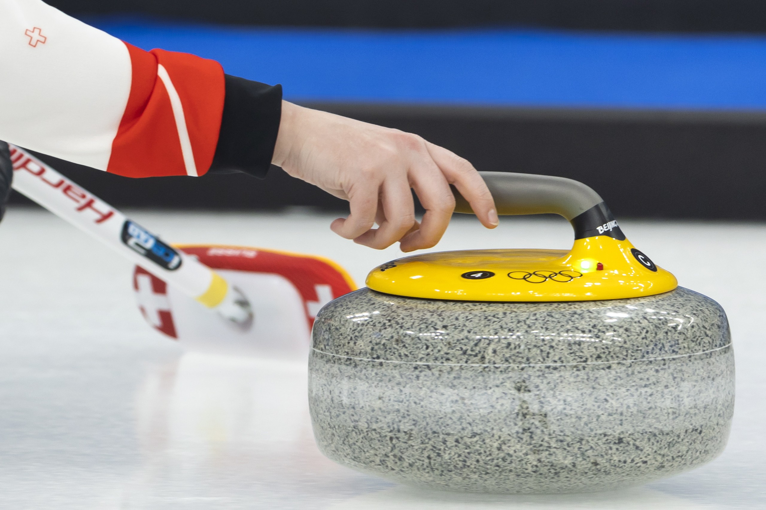 epa09730131 Jenny Perret of Switzerland releases her stone during the Curling mixed doubles preliminary round game between the Czech Republic and Switzerland at the Beijing 2022 Olympic Games in Beijing, China, 05 February 2022.  EPA/SALVATORE DI NOLFI