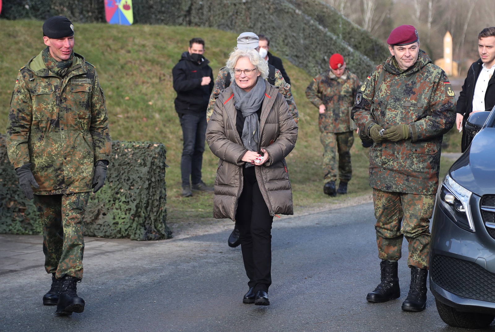 epa09735142 The German Minister of Defense Christine Lambrecht (C) with the commander of the 9th Panzerlehr Brigade Christian Freuding during her visit at the 9th Panzerlehr Brigade of the German Bundeswehr in Munster, northern Germany, 07 February 2022. At the moment, 200 soldiers of the 9th Panzerlehr Brigade take part in the NATO mission enhanced Forward Presence (eFP) in Lithuania.  EPA/FOCKE STRANGMANN