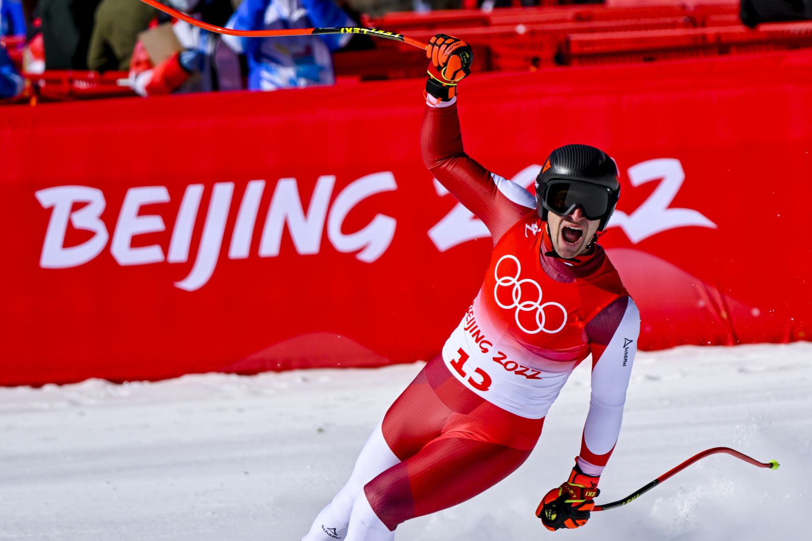 epa09737333 Matthias Mayer of Austria celebrates after his run in the Men's Super-G race of the Alpine Skiing events of the Beijing 2022 Olympic Games at the Yanqing National Alpine Ski Centre Skiing, Beijing municipality, China, 08 February 2022.  EPA/JEAN-CHRISTOPHE BOTT