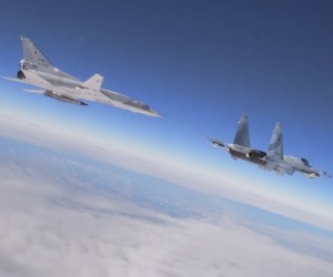 epa09743304 A handout still image taken from handout video made available by the Russian Defence ministry press-service shows a Tu-22M3 long-range bomber (L) and a fighter SU-30 SM of the Russian Aerospace Forces during the second patrol in the current month in the airspace of the Republic of Belarus during the inspection of the reaction forces of the Union State (Russia and Belarus) in Belarus, 10 February 2022. The joint military exercises of the armed forces of Russia and Belarus 'Allied Resolve - 2022' will be held from 10 to 20 February.  EPA/RUSSIAN DEFENCE MINISTRY PRESS SERVICE HANDOUT  HANDOUT EDITORIAL USE ONLY/NO SALES