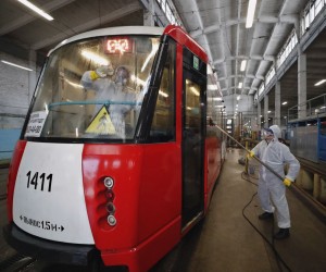 epa09743552 A worker disinfects a tram car before it enters the route at the tram depot in St. Petersburg, Russia, 10 February 2022. As part of the ongoing efforts to slow the spread of SARS-CoV-2, all urban vehicles are washed with disinfectants several times a day. Russia reported a record number of over 197,000 new daily Covid-19 cases, according to the national coronavirus information center.  EPA/ANATOLY MALTSEV