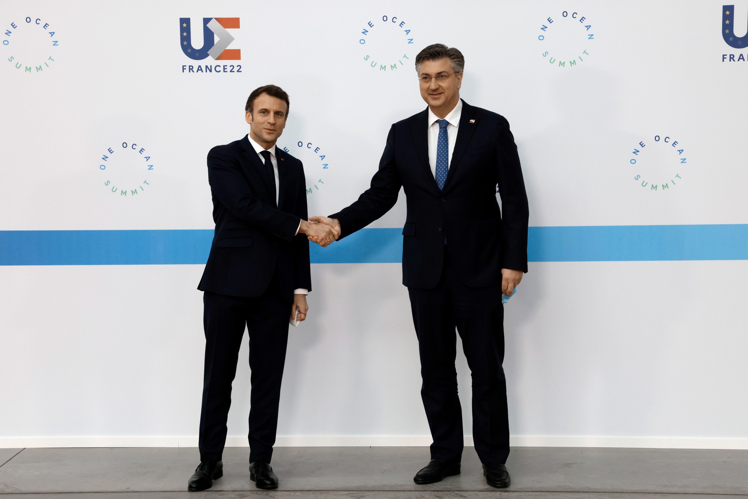 epa09746092 France's President Emmanuel Macron (L) welcomes Croatia's Prime Minister Andrej Plenkovic (R) before the High Level Segment session of the One Ocean Summit, in Brest, France, 11 February 2022. The session seeks to raise the international community's ambitions to protect sealife, cut plastic pollution and tackle the impact of climate change.  EPA/LUDOVIC MARIN / POOL  MAXPPP OUT