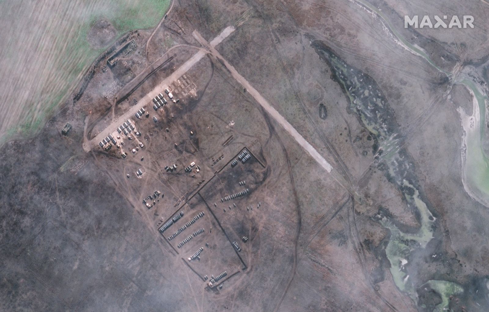epa09749812 A handout satellite image made available by Maxar Technologies shows alleged new deployments at Slavne, Crimea, 09 February 2022 (issued 12 February 2022). More than 550 troop tents and hundreds of vehicles have arrived at the Oktyabrskoye airfield north of Simferopol, and a new deployment was identified near the town of Slavne, Maxar says.  EPA/MAXAR TECHNOLOGIES HANDOUT -- MANDATORY CREDIT: SATELLITE IMAGE 2022 MAXAR TECHNOLOGIES -- THE WATERMARK MAY NOT BE REMOVED/CROPPED -- HANDOUT EDITORIAL USE ONLY/NO SALES