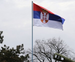 epa09756371 A Serbian flag flies high over the canons firing the honorary minute fire on the eve of Serbia's Statehood Day, in Belgrade, Serbia, 14 February 2022. Also known as Serbia's National Day, Statehood Day is celebrated annualy on 15 February to mark the recognition of the Serbian state from the Ottoman Empire back in 1804.  EPA/ANDREJ CUKIC