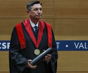 epa09758795 Slovenia's President Borut Pahor during the ceremony of awarding the Doctor Honoris Causa by the Higher Institute of Social and Political Sciences (ISCSP) of the University of Lisbon in Lisbon, Portugal, 15 February 2022. Borut Pahor is on a two-day official visit to Portugal.  EPA/ANTONIO COTRIM