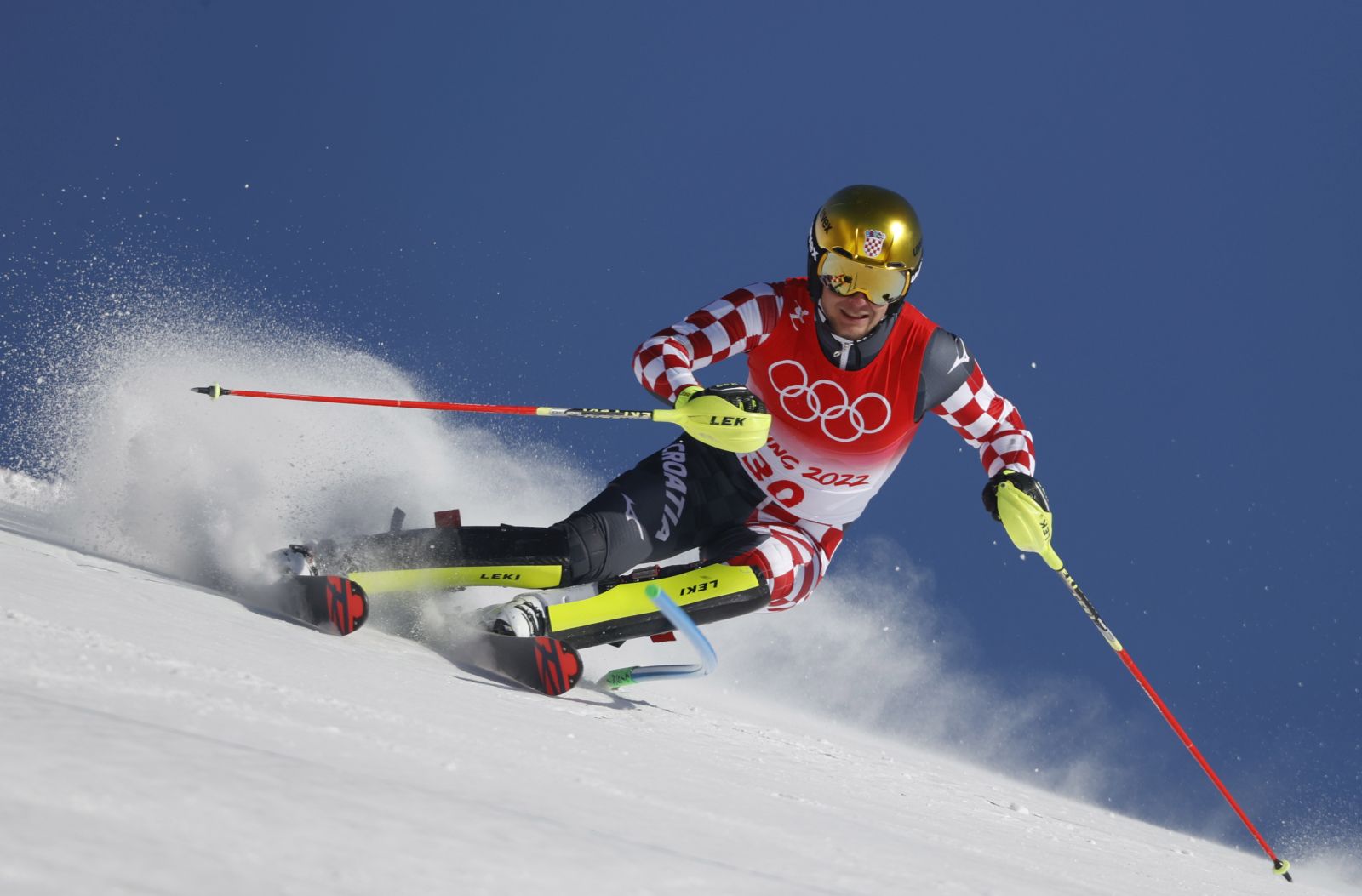 epa09760888 Samuel Kolega of Croatia clears a gate during the second run of the Men's Slalom race of the Alpine Skiing events of the Beijing 2022 Olympic Games at the Yanqing National Alpine Ski Centre Skiing, Beijing municipality, China, 16 February 2022.  EPA/GUILLAUME HORCAJUELO