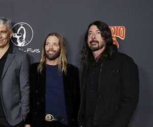 epa09764501 (L-R) US musicians Rami Jaffee, Chris Shiflett, Nate Mendel, US comedian Whitney Cummings, US musicians Pat Smear, Taylor Hawkins, and Dave Grohl, attend the premiere of the movie 'Studio 666' at the TCL Chinese Theater in Los Angeles, California, USA, 16 February 2022.  EPA/CAROLINE BREHMAN