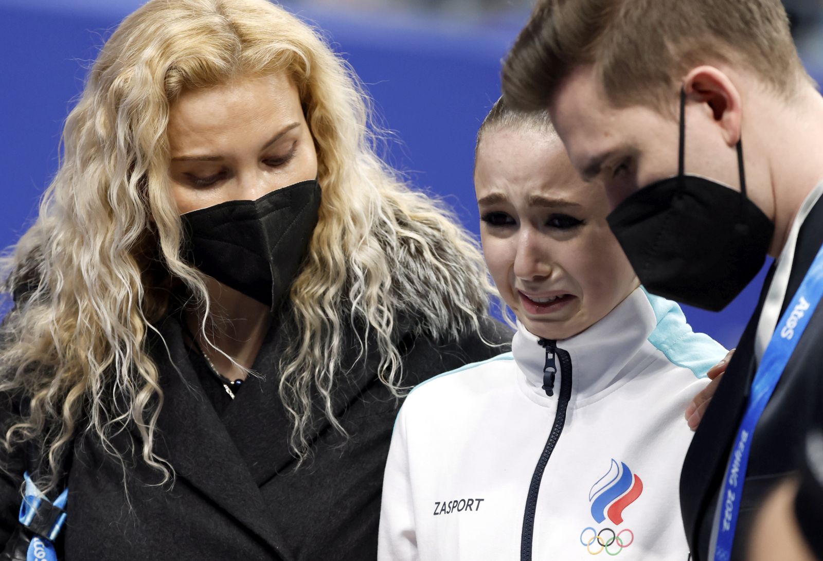 epa09766728 Kamila Valieva (C) of Russian Olympic Committee cries next her coach Eteri Tutberidze (L) after  the Women's Free Skating of the Figure Skating events at the Beijing 2022 Olympic Games, Beijing, China, 17 February 2022.  EPA/HOW HWEE YOUNG